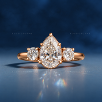 Whispering Romance Pear Cut Three-Stone Engagement Ring