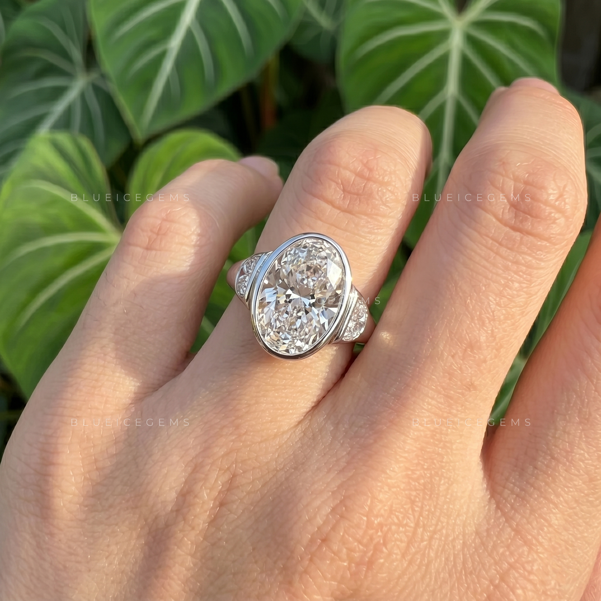 Majestic Harmony Oval Cut Bezel Three Stone Half Moon Engagement Ring