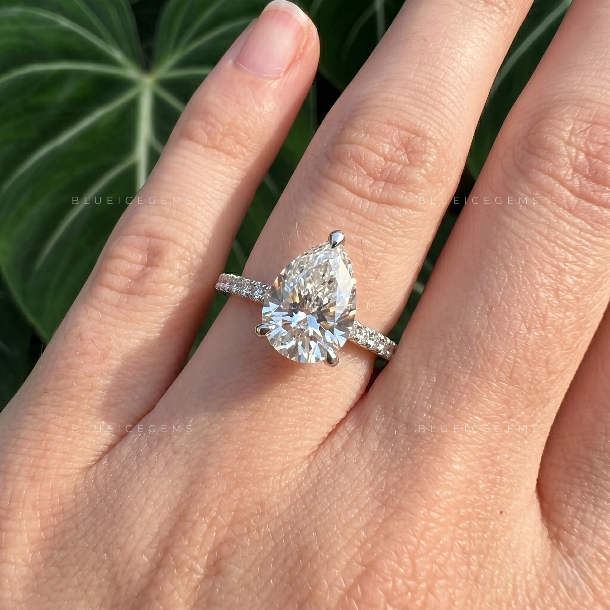 Graceful Pear Cut Hidden Halo Engagement Ring