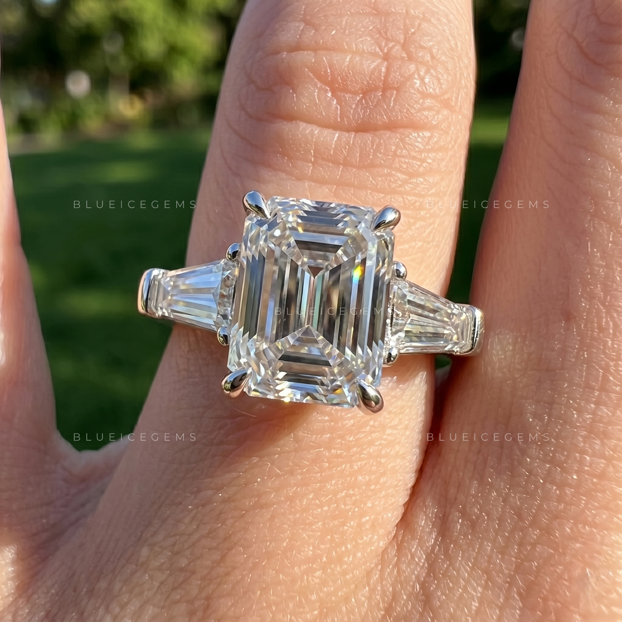 Classic Grace Emerald Cut Three Stone Engagement Ring