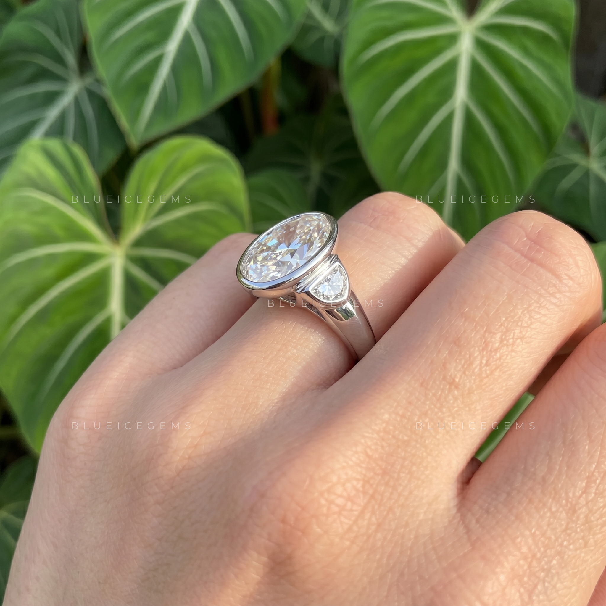 Majestic Harmony Oval Cut Bezel Three Stone Half Moon Engagement Ring