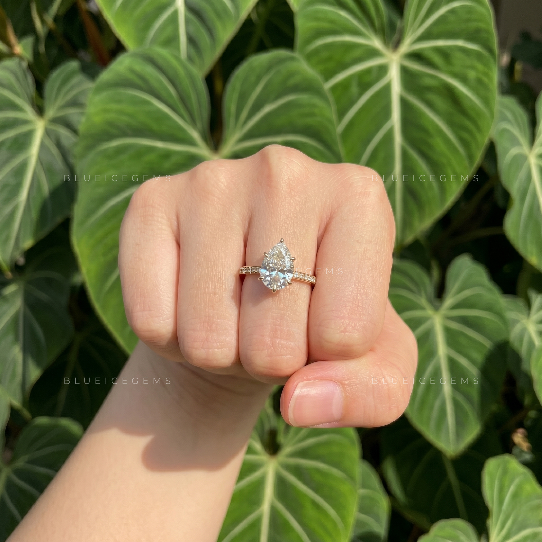 Captivating Tear Drop Pear Cut Solitaire Engagement Ring with Accent Detail