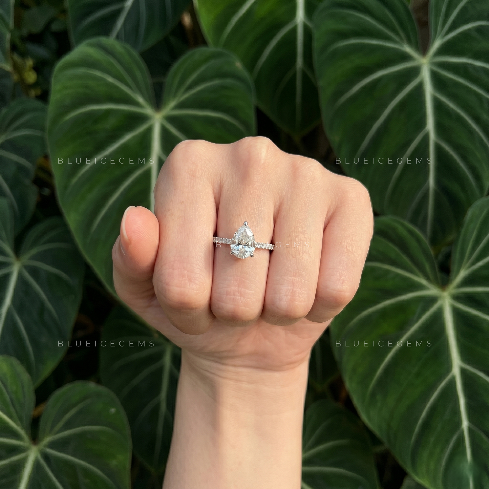 Graceful Pear Cut Hidden Halo Engagement Ring