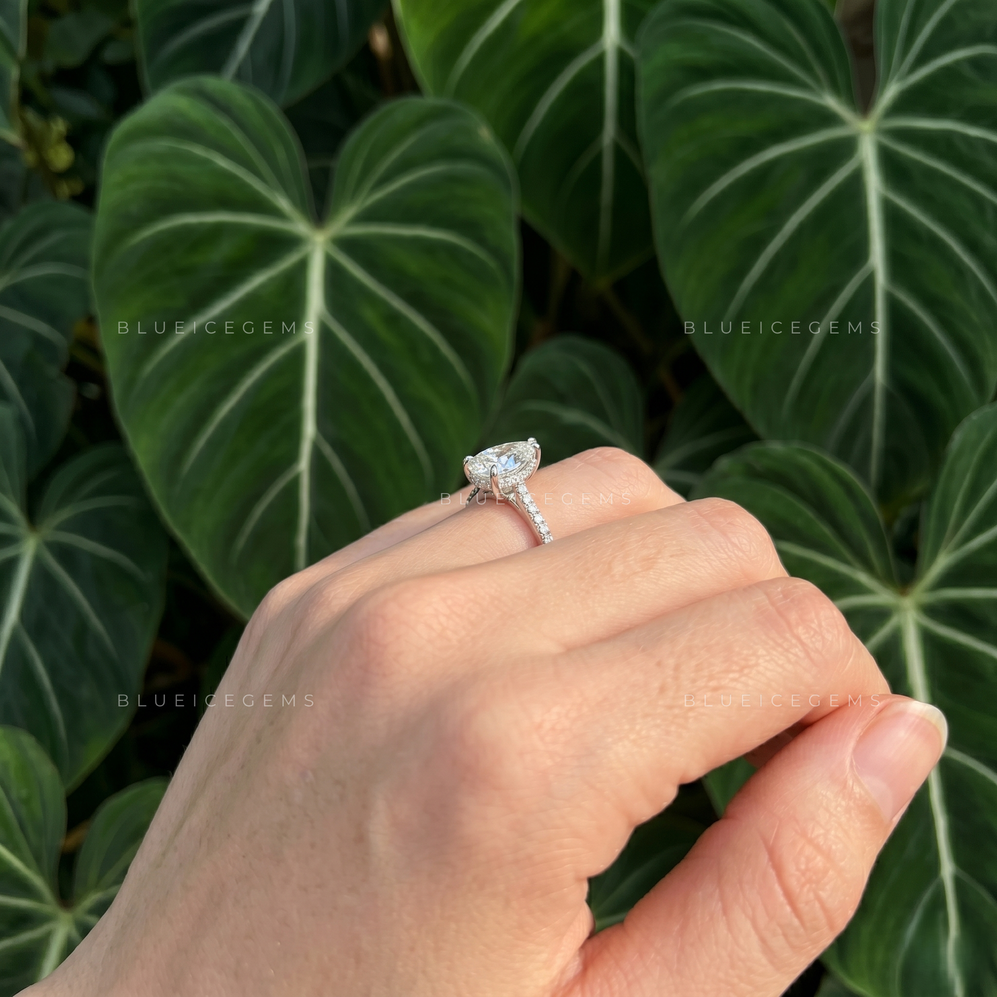 Graceful Pear Cut Hidden Halo Engagement Ring