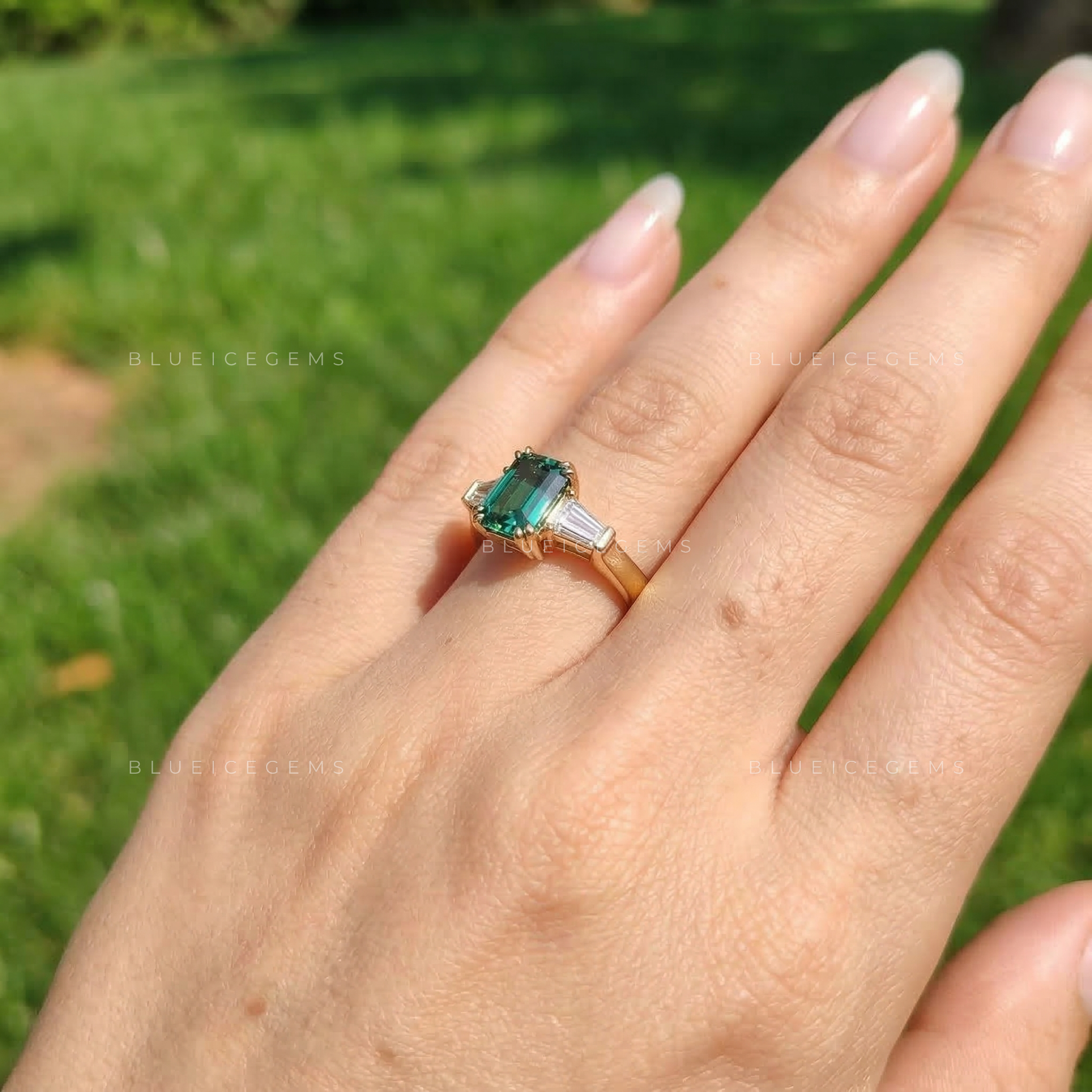 Verdant Elegance Emerald Cut Three-Stone Ring