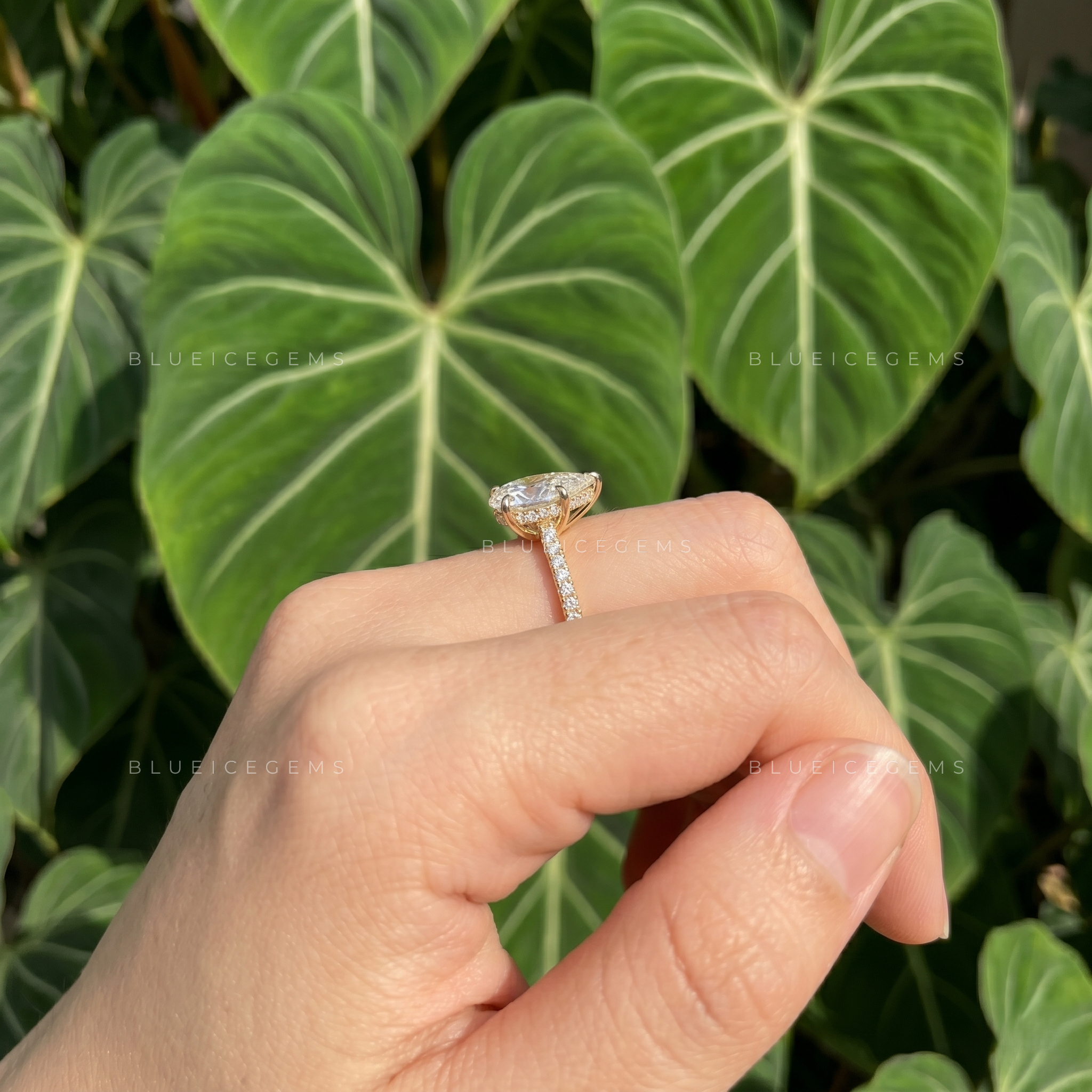 Captivating Tear Drop Pear Cut Solitaire Engagement Ring with Accent Detail