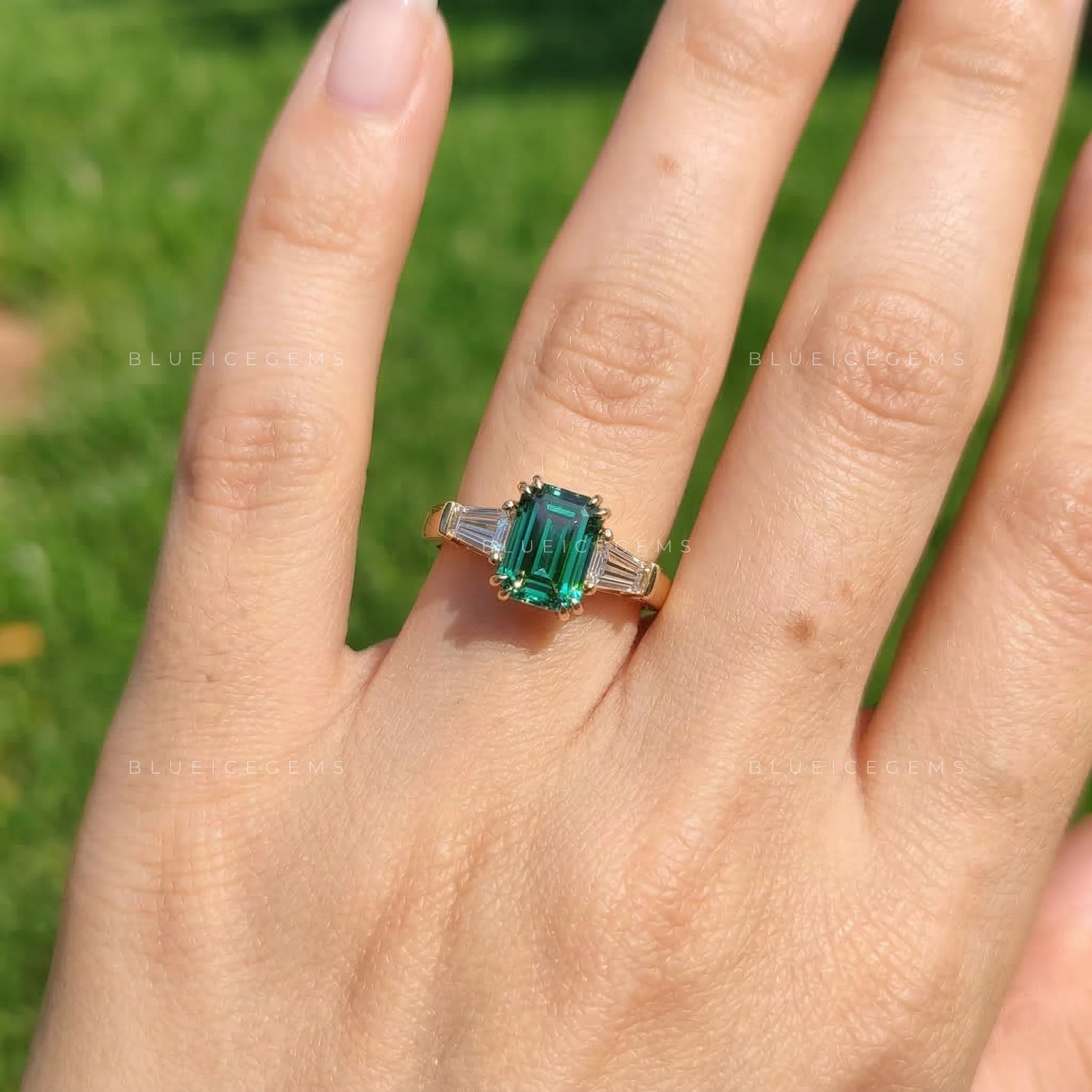 Verdant Elegance Emerald Cut Three-Stone Ring