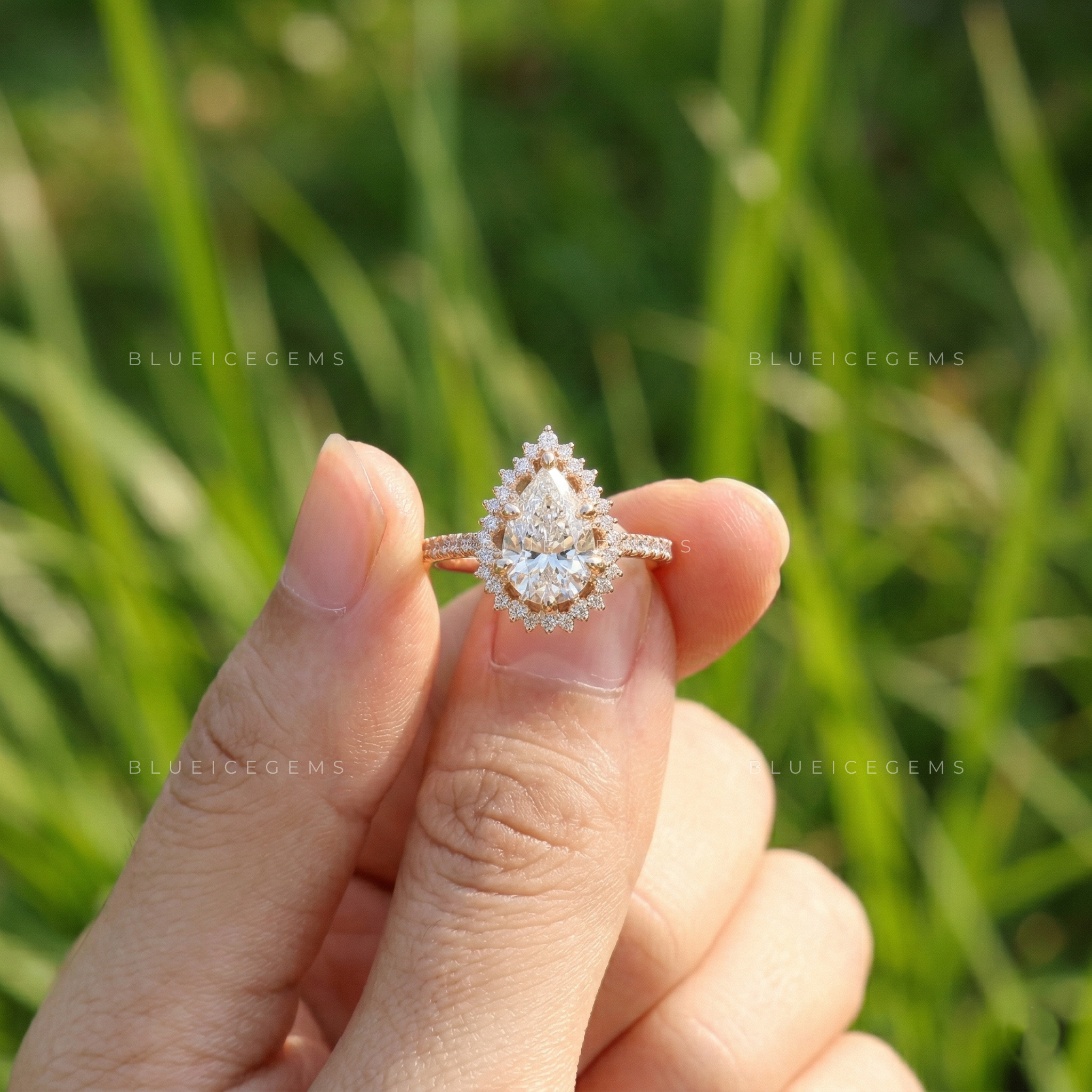 Graceful Pear Cut Halo Side Stone Engagement Ring