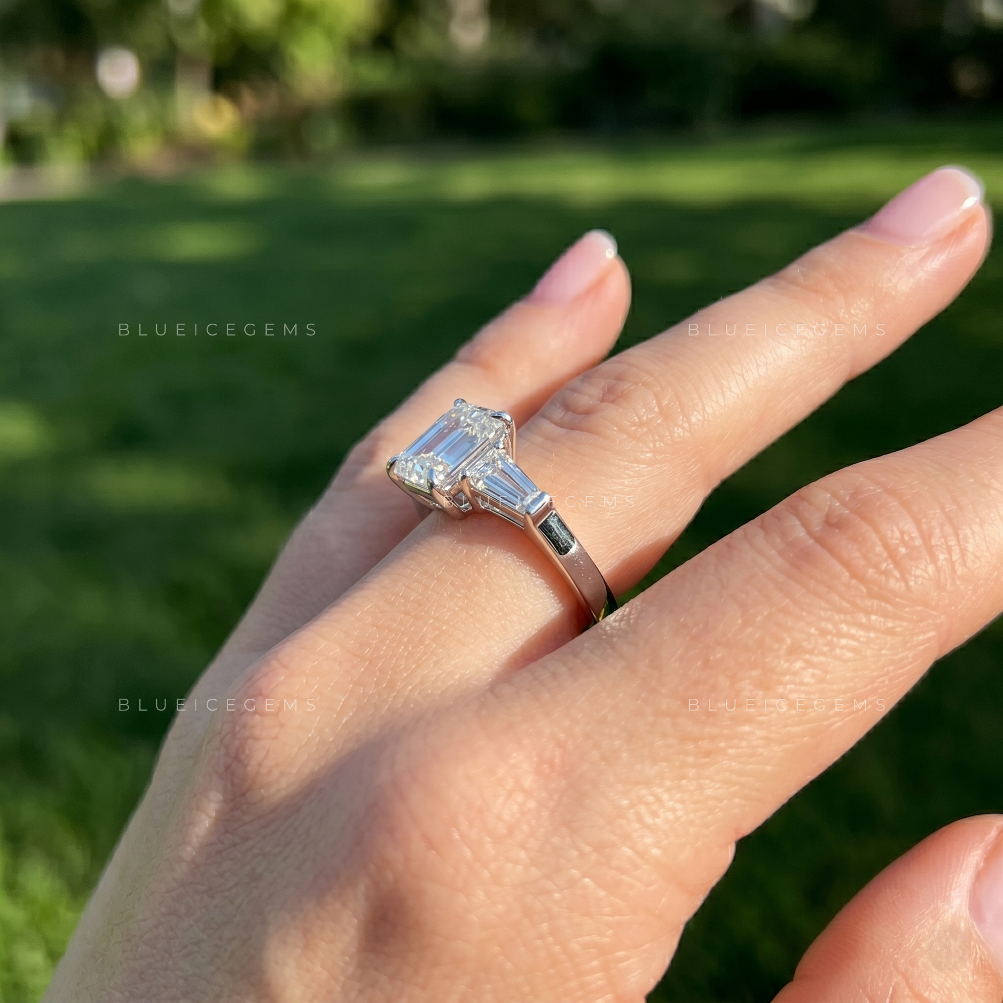 Classic Grace Emerald Cut Three Stone Engagement Ring