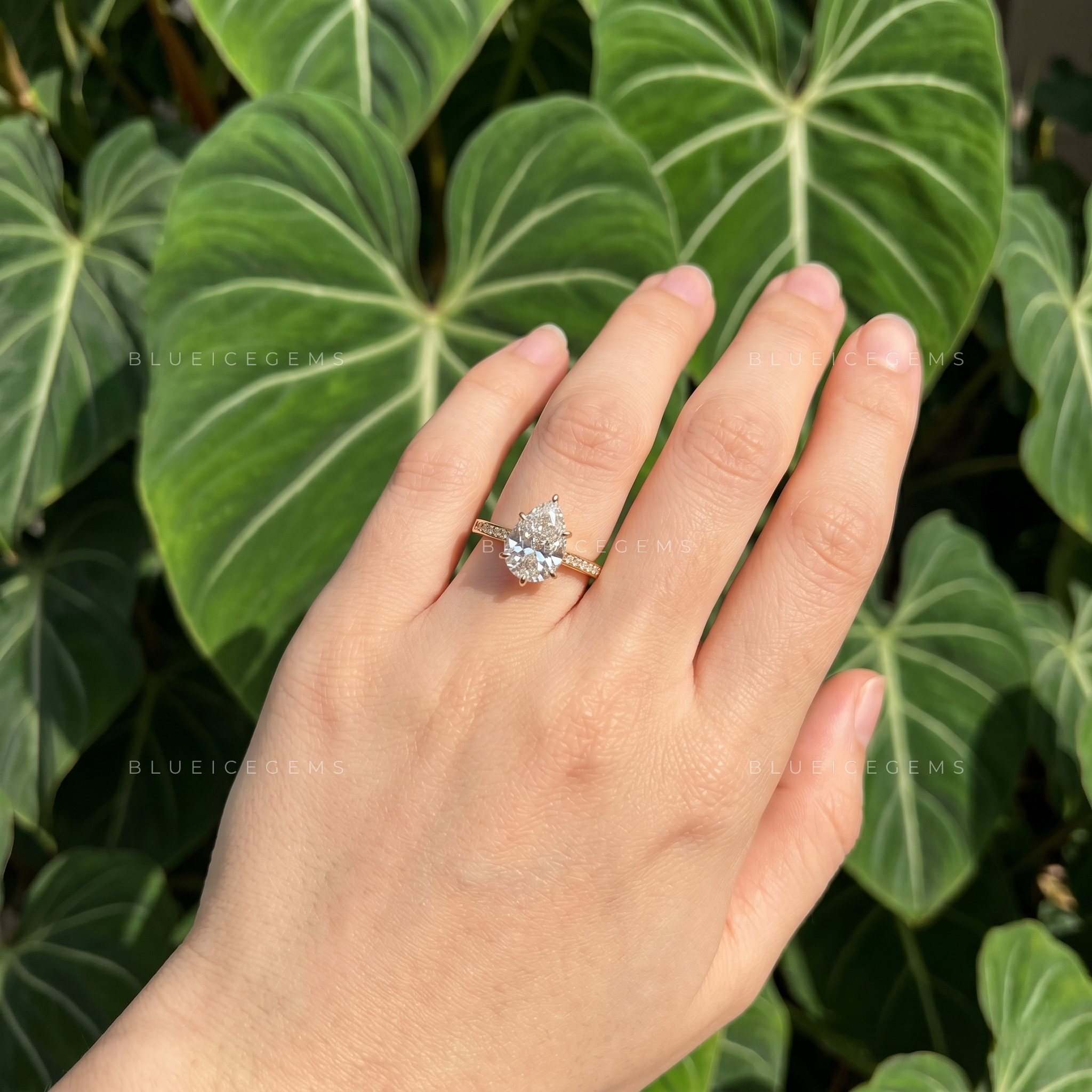 Captivating Tear Drop Pear Cut Solitaire Engagement Ring with Accent Detail
