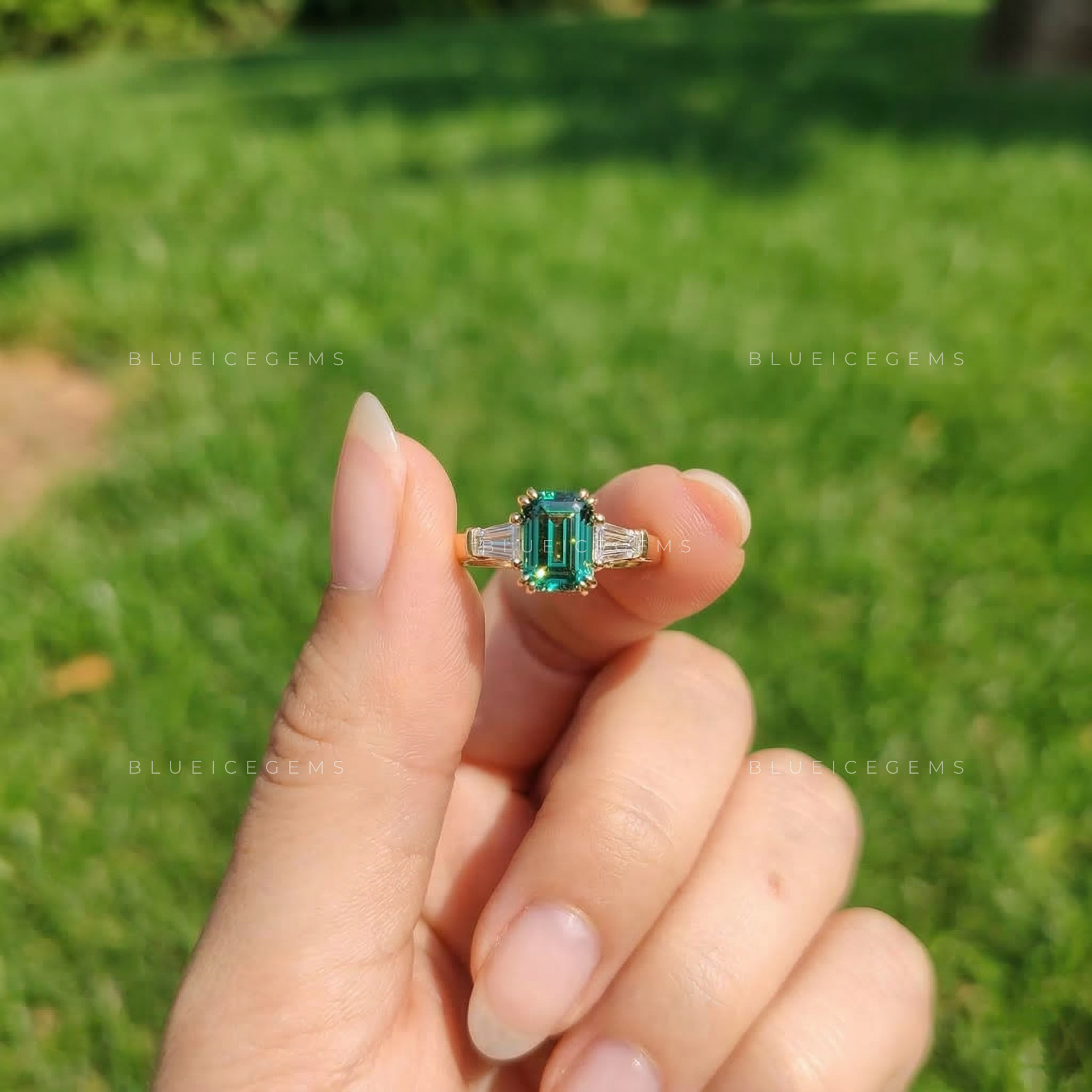 Verdant Elegance Emerald Cut Three-Stone Ring