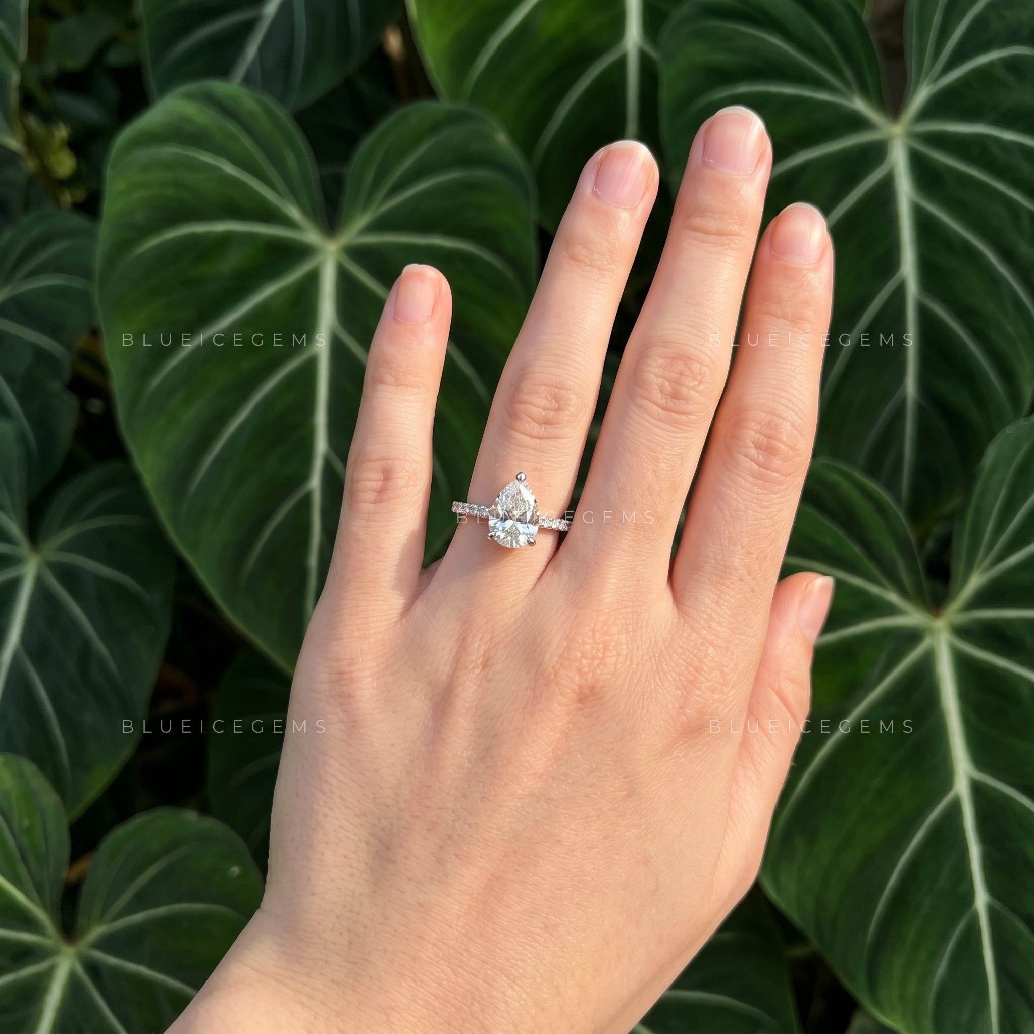 Graceful Pear Cut Hidden Halo Engagement Ring