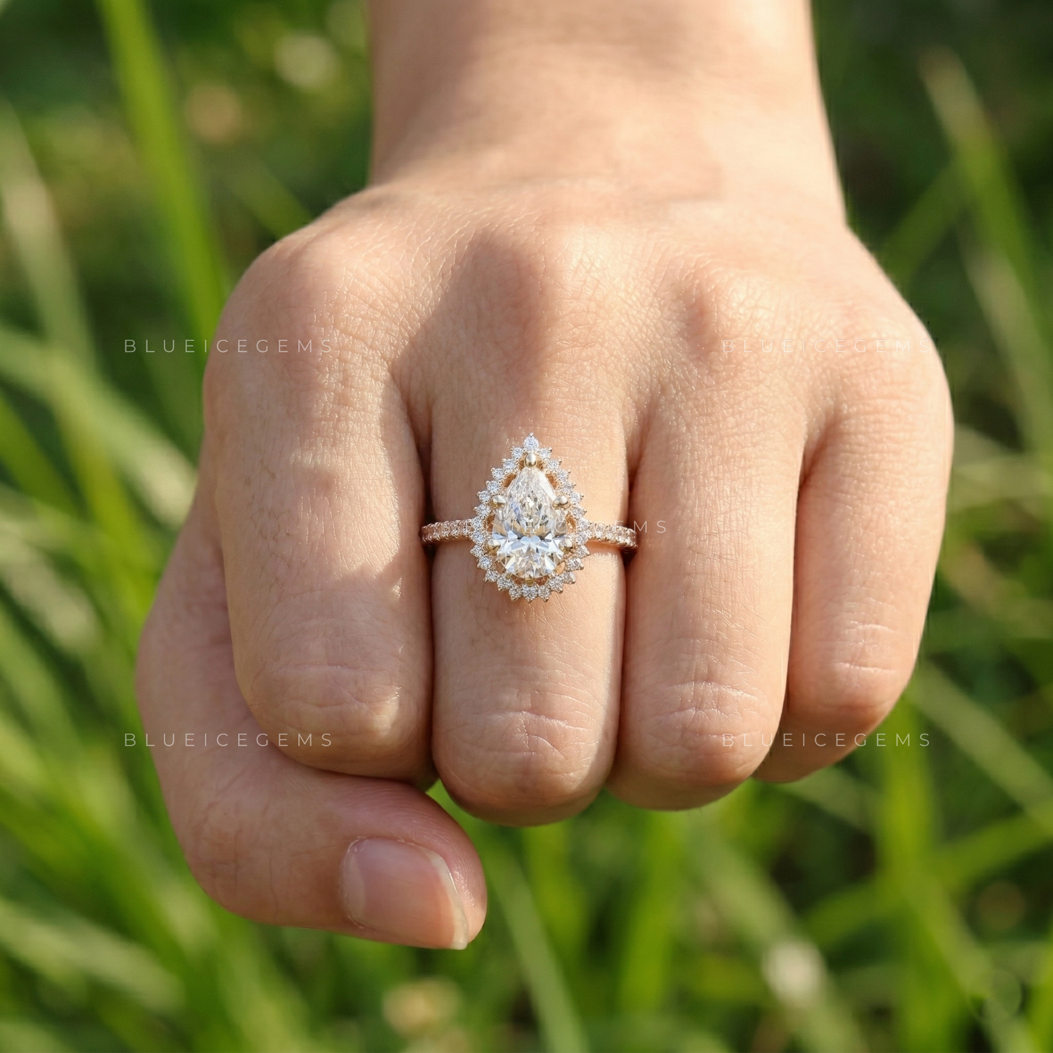 Graceful Pear Cut Halo Side Stone Engagement Ring