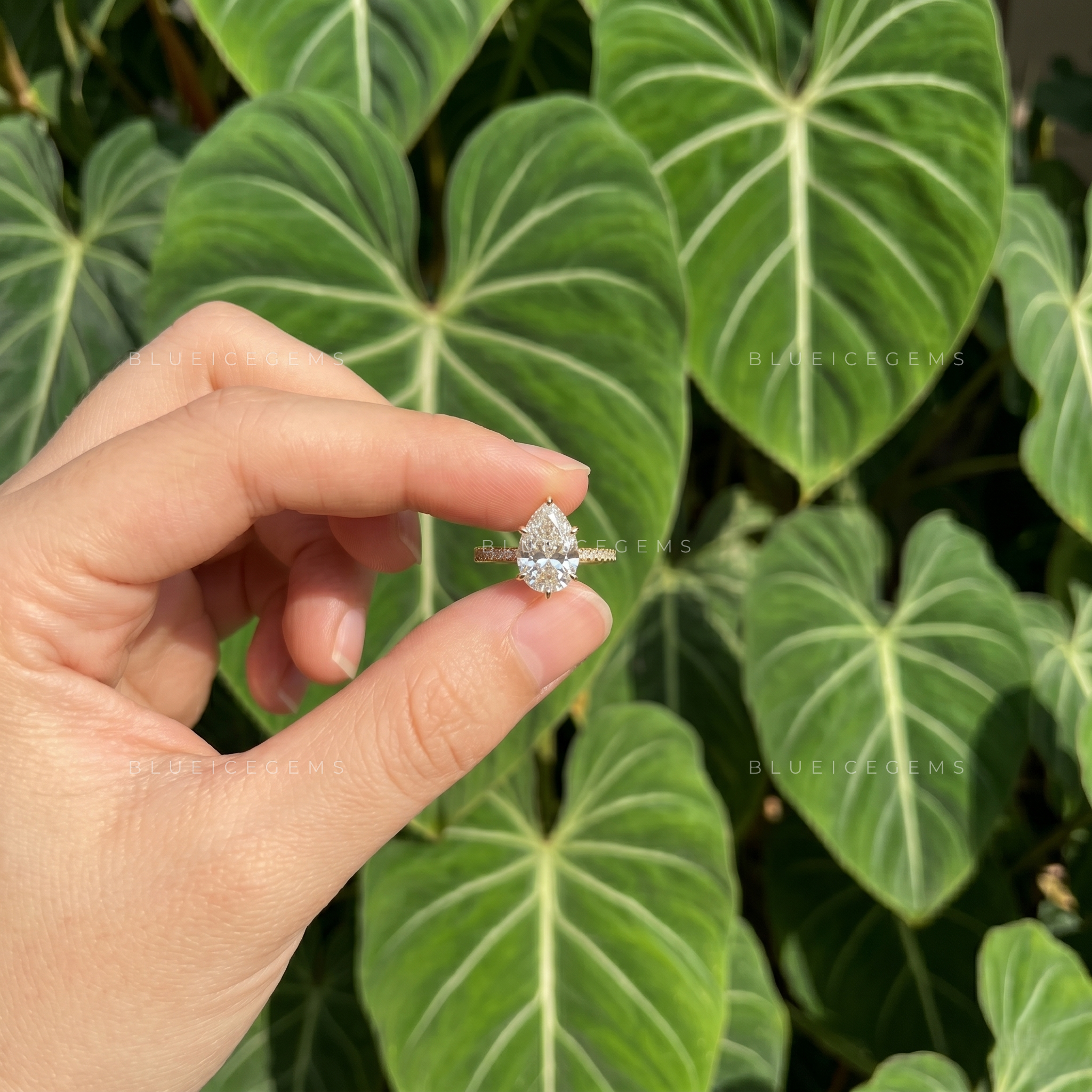 Captivating Tear Drop Pear Cut Solitaire Engagement Ring with Accent Detail