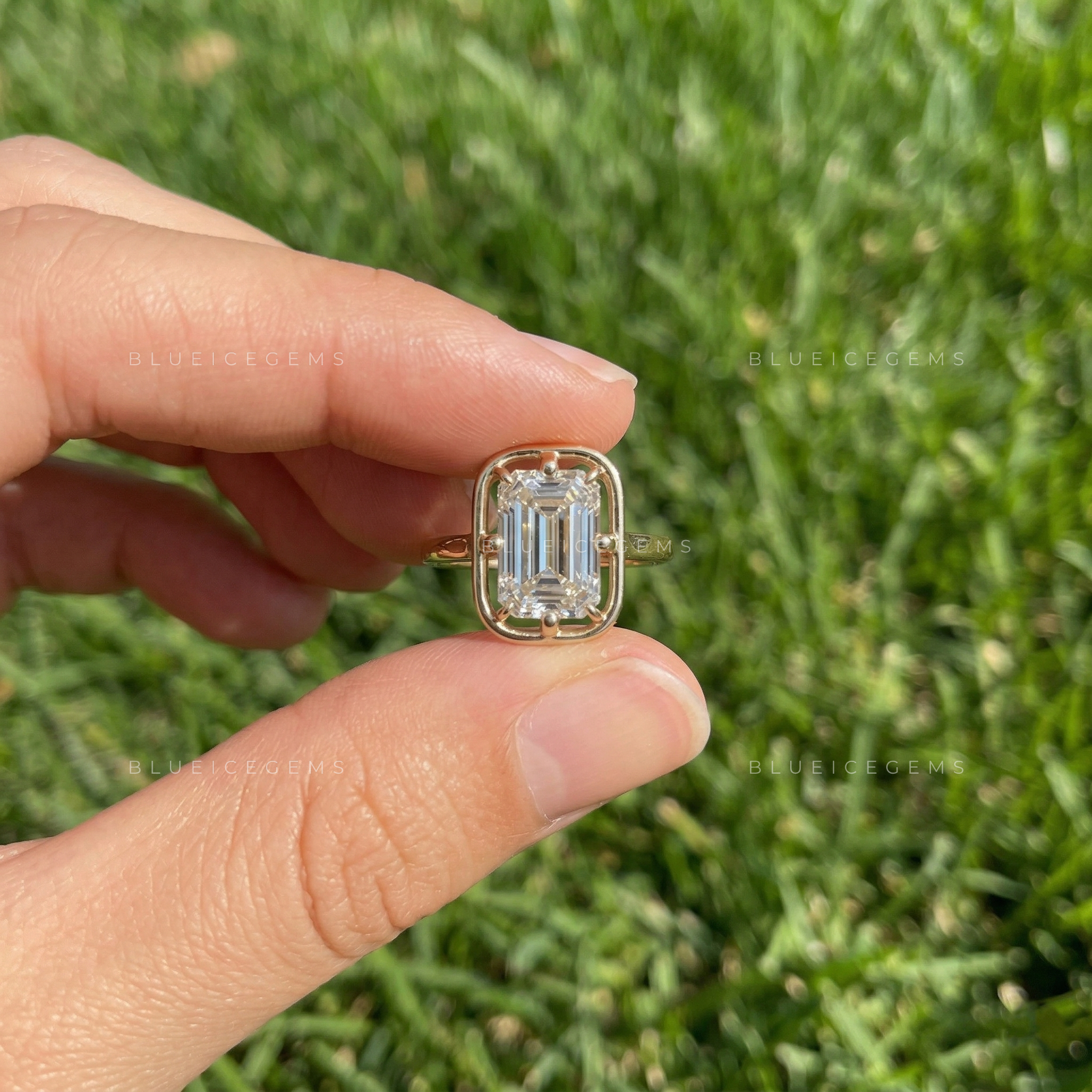 Refined Emerald Cut Solitaire Open Gallery Engagement Ring