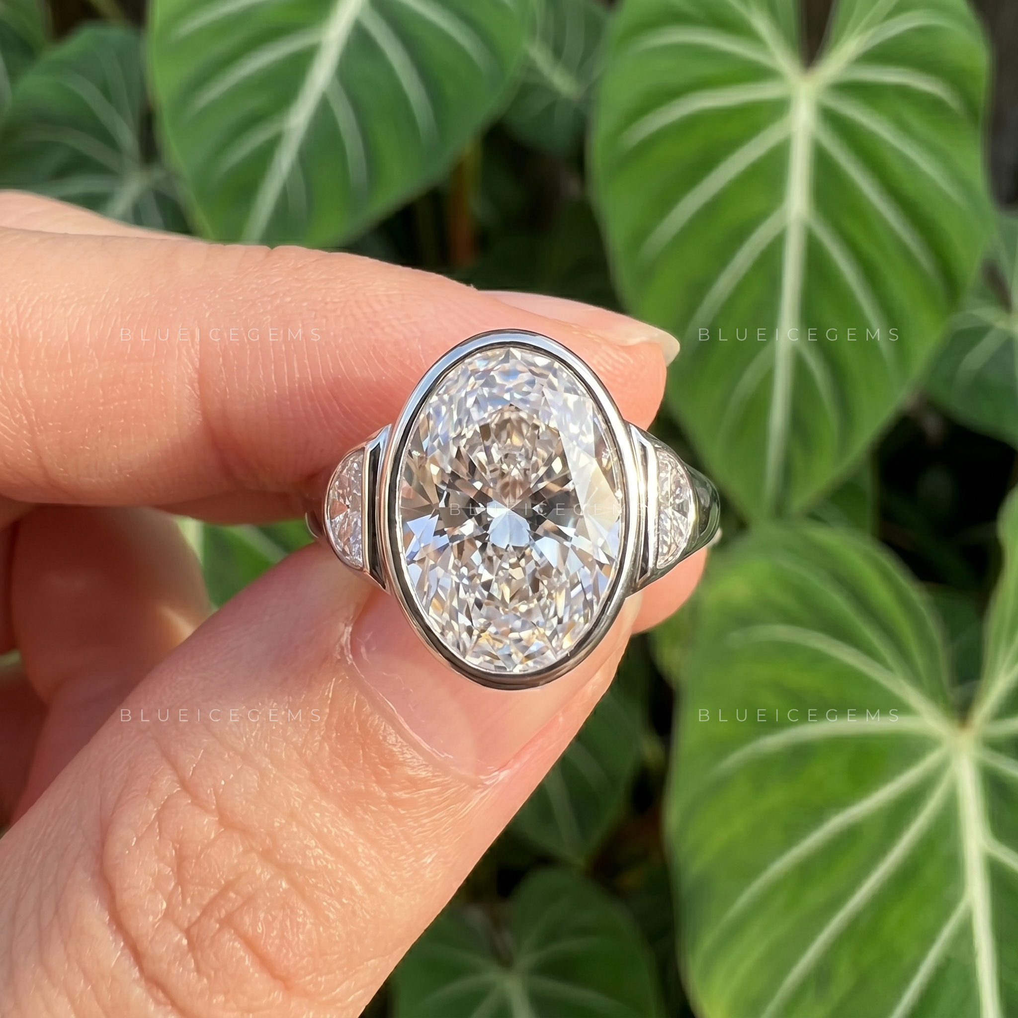 Majestic Harmony Oval Cut Bezel Three Stone Half Moon Engagement Ring