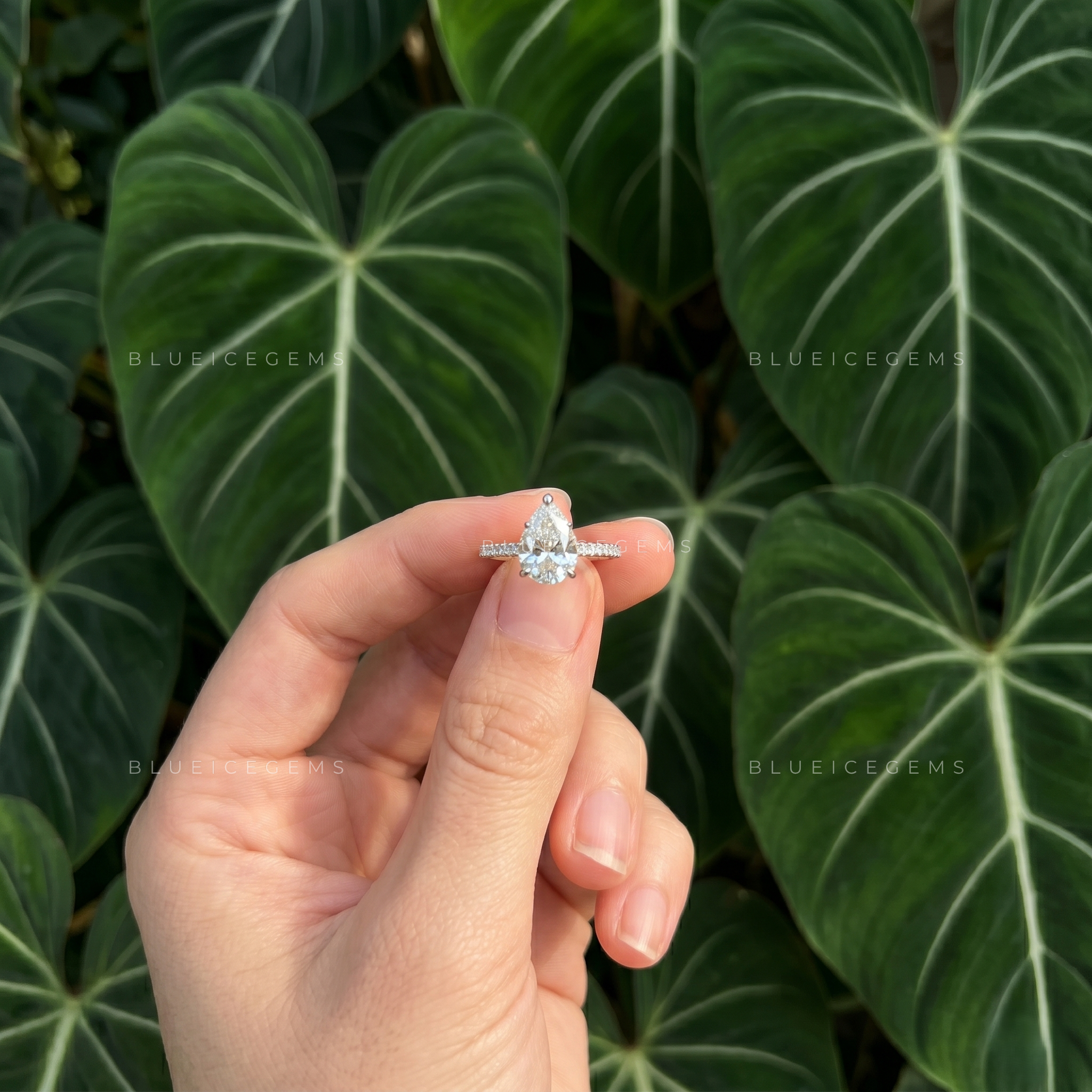 Graceful Pear Cut Hidden Halo Engagement Ring