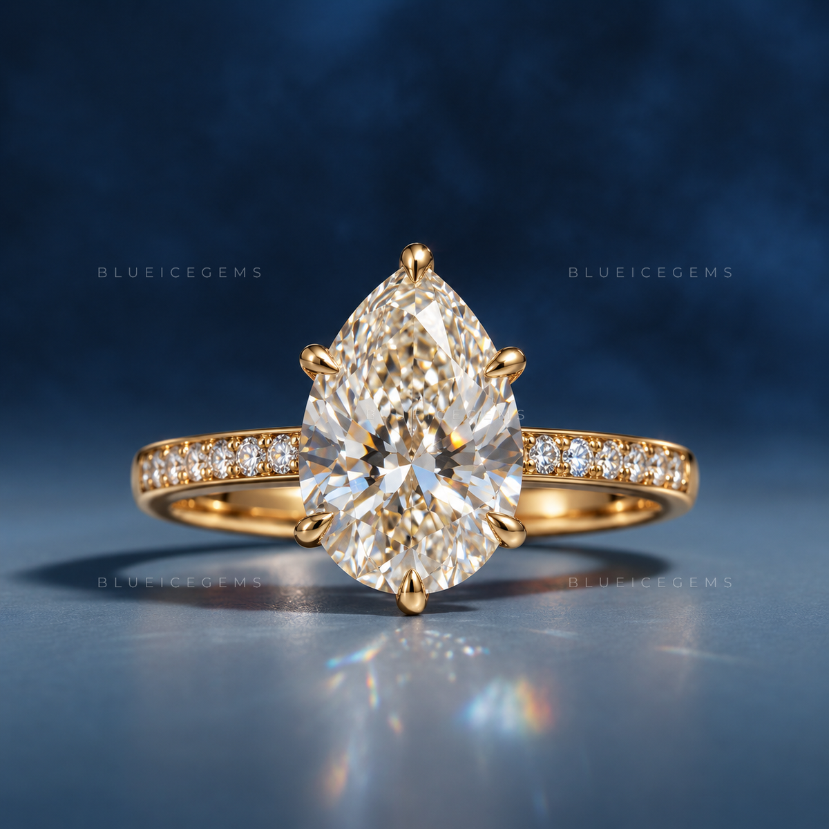 Captivating Tear Drop Pear Cut Solitaire Engagement Ring with Accent Detail